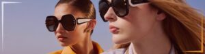 Two women wearing sunglasses by Carolina Herrera